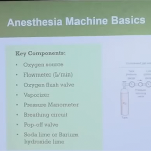 Presentation slide titled Anesthesia Machine Basics listing key components including oxygen source, flowmeter, oxygen flush valve, vaporizer, pressure manometer, breathing circuit, pop-off valve, and soda lime or barium hydroxide lime.